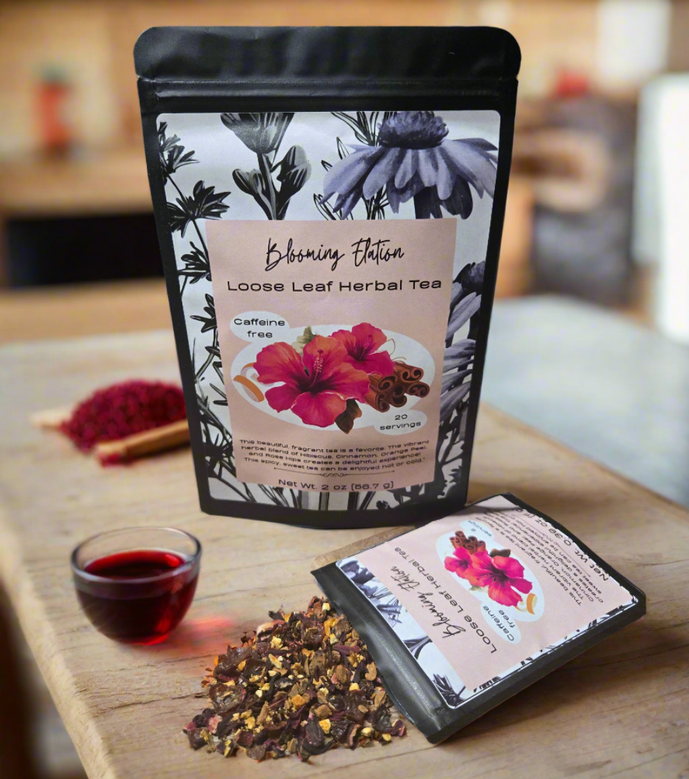 Loose leaf herbal tea package with hibiscus flowers, cinnamon, rose hips, and orange peel on a wooden surface